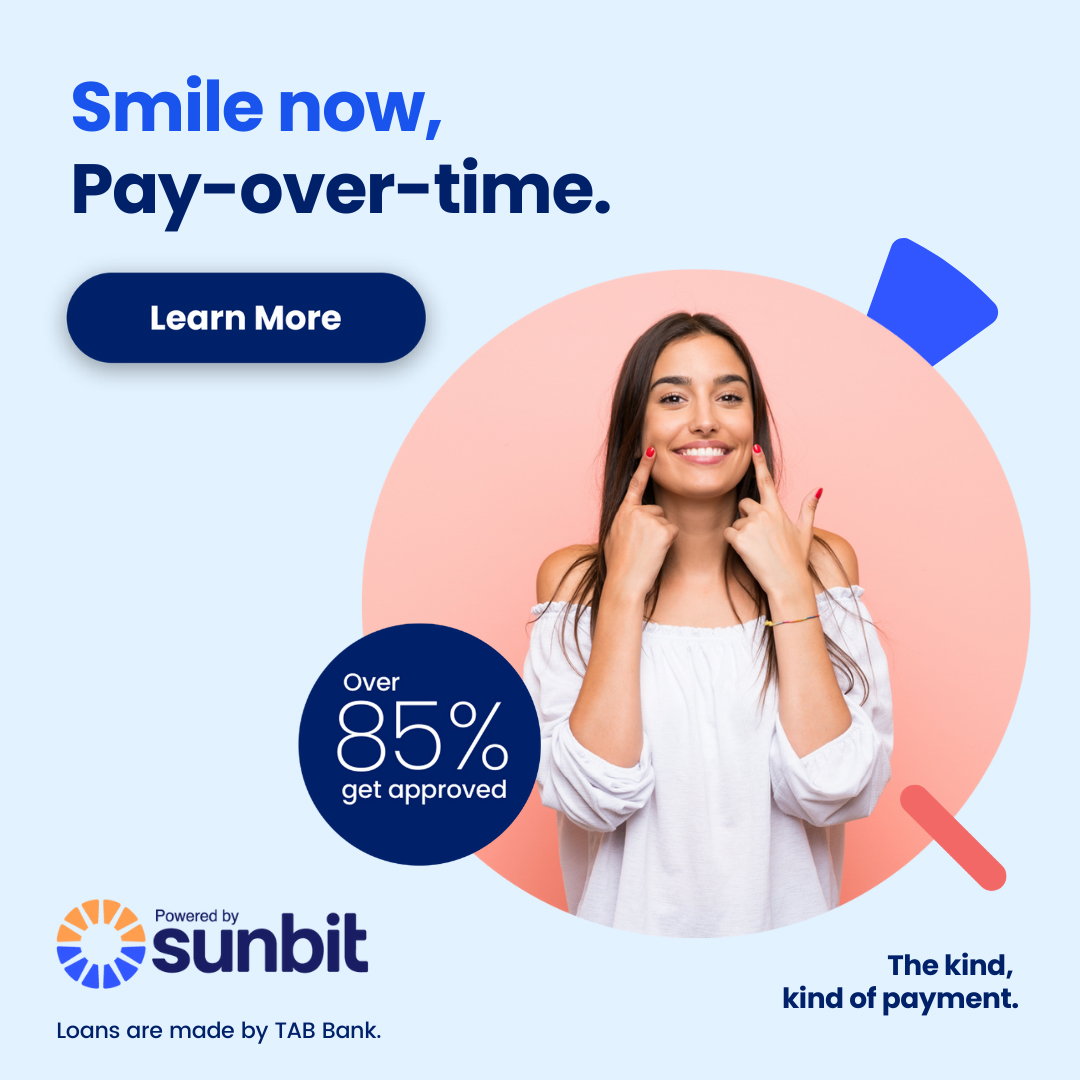 Smiling woman in white top touching face, promoting Sunbit dental payment financing with 85% approval rate offer.