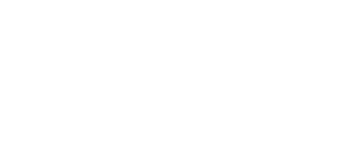 Dentist in white coat examining patient in dental chair at Coastal Dental Arts office.